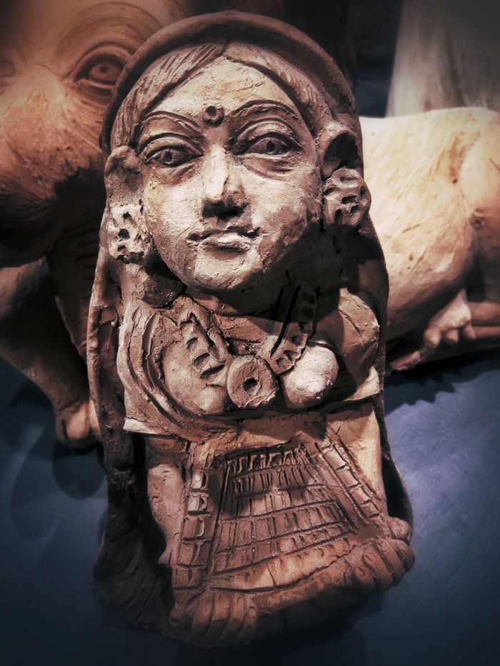 Traditional wooden figurine showcasing intricate carving details, perfect for artistic or cultural collections.